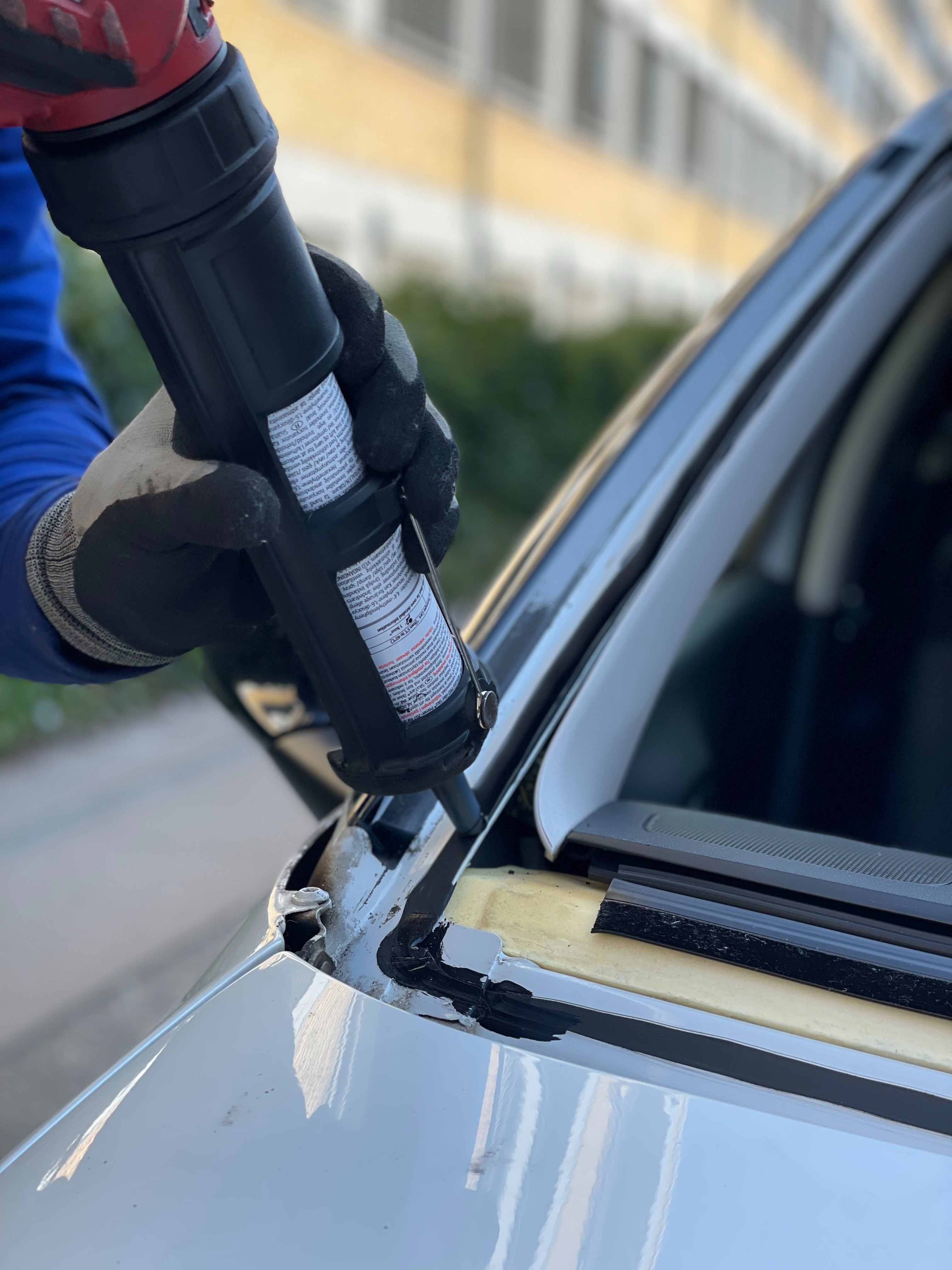 This image shows the close up of a windshield installation.